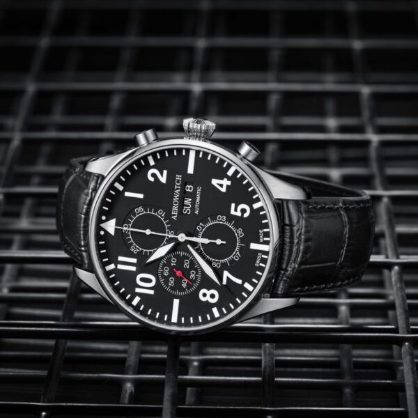 Montre Aerowatch Chrono Pilote Auto sur fond grille