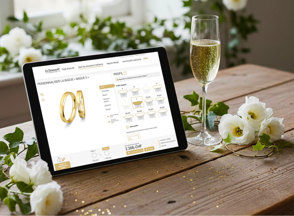Tablette affichant site vente bagues, verre de champagne